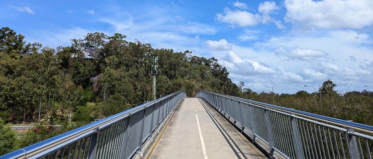 The Indooroopilly Green Bridge soars over Moggil Road